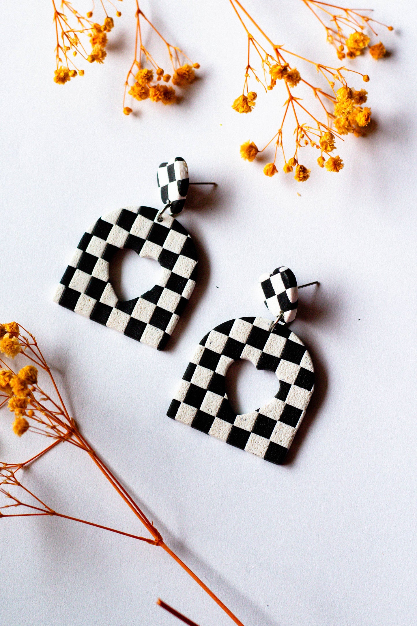 Checkerboard Heart Cutout Dangle Earrings (Black and White)