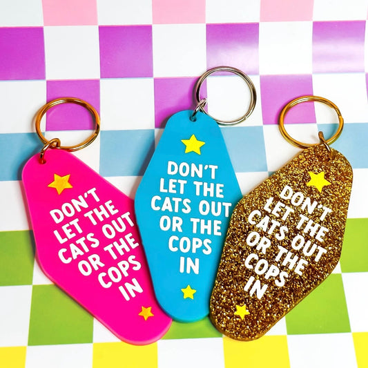 Don't Let the Cats Out or the Cops In Keychain (Pink)